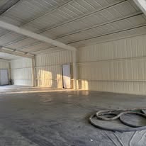 Interior metal shop bay with concrete floor
